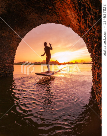 Hydrofoil rider gliding over the water Hydrofoil rider gliding over the water 124627828