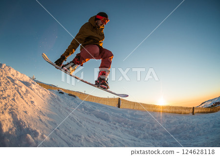 Snowboarding in the mountains Snowboarding in the mountains 124628118