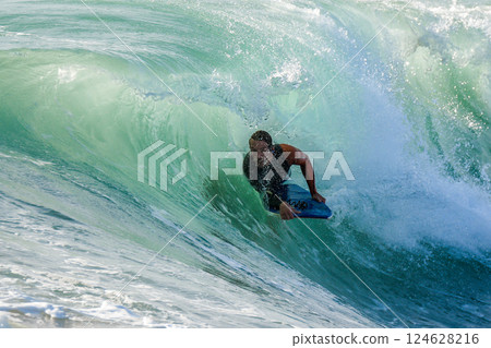 Bodyboarder in action Bodyboarder in action 124628216