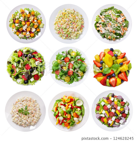 Set of various plates of salad isolated on white background 124628245