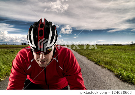 Cyclist on the road 124628663