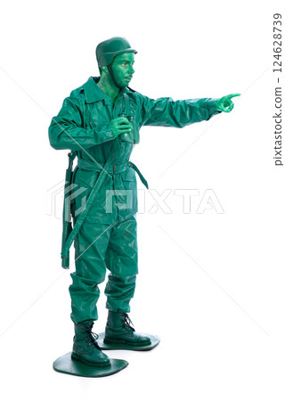 Man on a green toy soldier costume 124628739