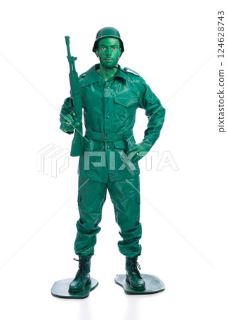 Man on a green toy soldier costume 124628743