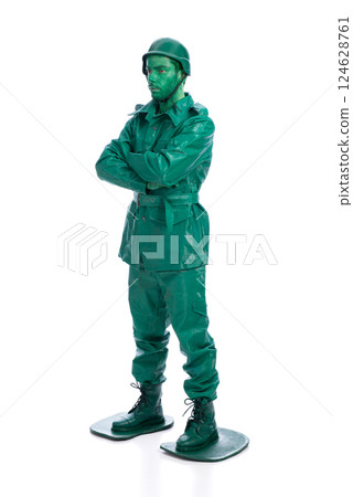 Man on a green toy soldier costume Man on a green toy soldier costume 124628761