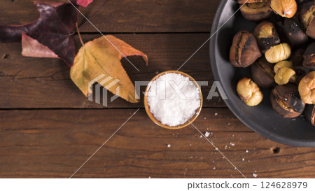 Roasted chestnuts in cast iron pan Roasted chestnuts in cast iron pan 124628979