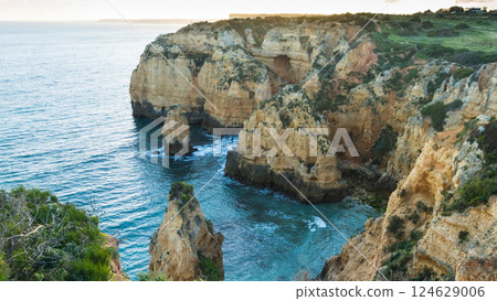 Sunset over the cliffs and beaches 124629006