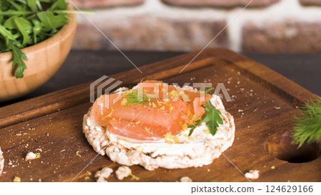 Smoked salmon on rice bread toasts 124629166