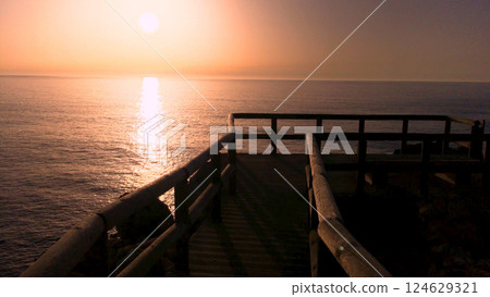 Sunset view from the wooden walkway Sunset view from the wooden walkway 124629321