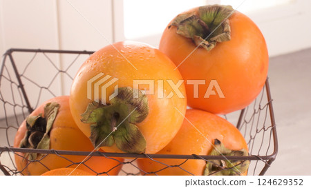 Delicious fresh persimmon fruit Delicious fresh persimmon fruit 124629352