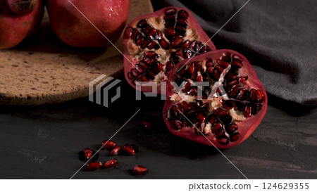 Ripe pomegranate and seeds 124629355