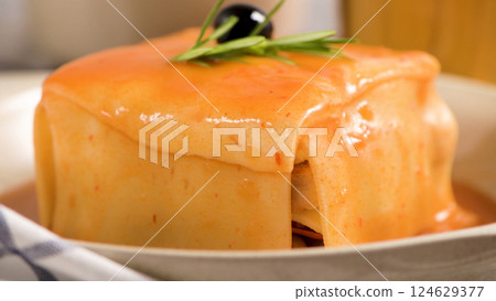 Francesinha on plate 124629377