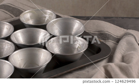 Baking forms smeared with butter Baking forms smeared with butter 124629496