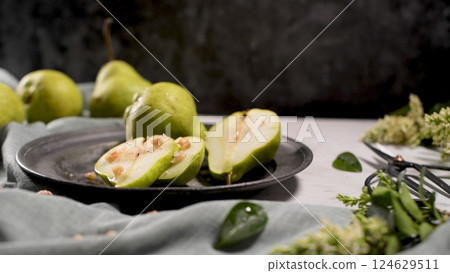 Metal plate with delicious ripe pears 124629511