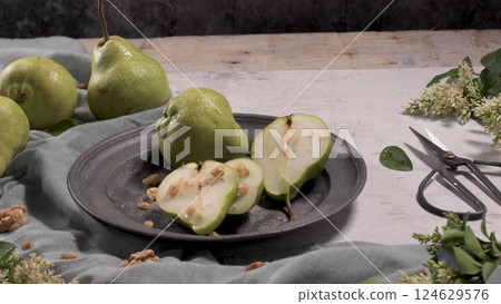 Metal plate with delicious ripe pears Metal plate with delicious ripe pears 124629576