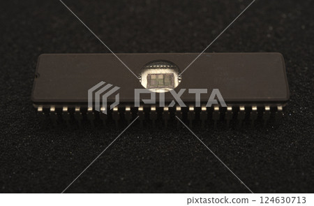 The microcircuit is on black foam. An integrated circuit for radio electronics. 124630713