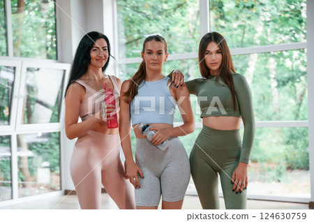 Group of women practicing fitness in the gym Group of women practicing fitness in the gym 124630759