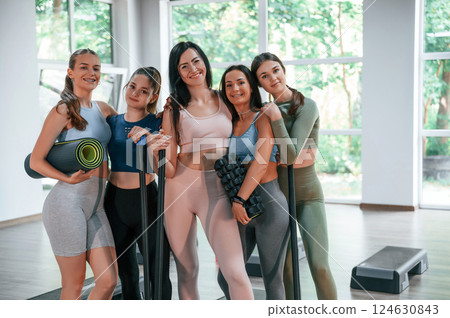 Standing together. Group of women practicing fitness in the gym 124630843