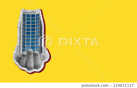 Real estate concept with agent holding model of modern apartment. New building with glass window, 124631137