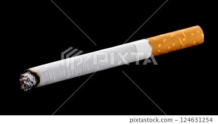 One cigarette. Black background. 124631254