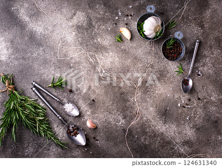 Rosemary, garlic, salt and pepper. 124631340