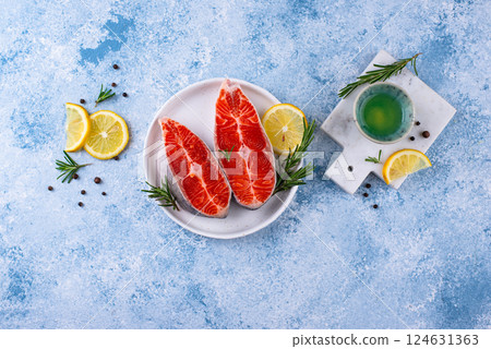 Raw uncooked salmon with rosemary Raw uncooked salmon with rosemary 124631363