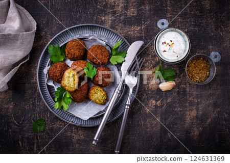 Middle Eastern falafel balls with sauce 124631369