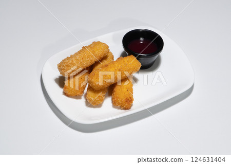 Golden Fried Mozzarella Sticks Served on a White Plate with Sweet Dipping Sauce Golden Fried Mozzarella Sticks Served on a White Plate with Sweet Dipping Sauce 124631404
