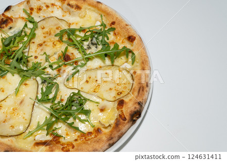 Delicious Gourmet Pizza with Melted Cheese, Fresh Rocket Leaves, and Thinly Sliced Eggplant 124631411