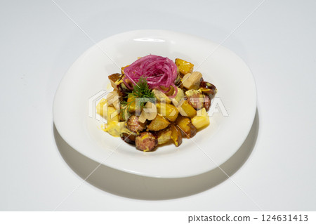 Delicious Golden Roasted Potato Salad with Sausage, Cheese, Mushrooms and Pickled Red Onion Beautifully Presented on White Plate 124631413