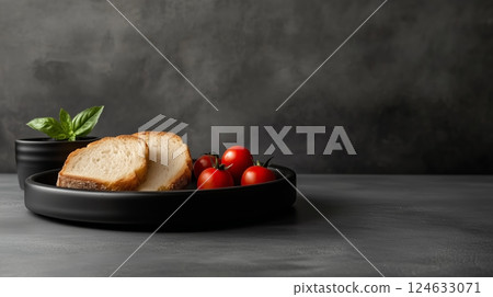 A kitchen with a black table with a black plate and sliced breads toasted on it 124633071