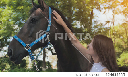 Young girl with a beloved horse on a summer day. Young girl with a beloved horse on a summer day. 124633335