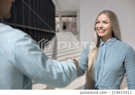 Applicant and HR manager shaking hands, getting acquainted Applicant and HR manager shaking hands, getting acquainted 124633911