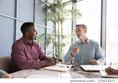 Businessman makes formal presentation to colleagues or business partners 124633973