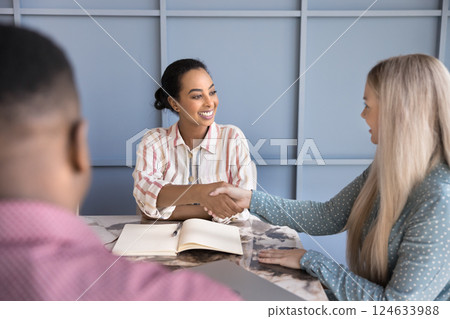 HR manager congratulates vacancy candidature with successful job interview HR manager congratulates vacancy candidature with successful job interview 124633988