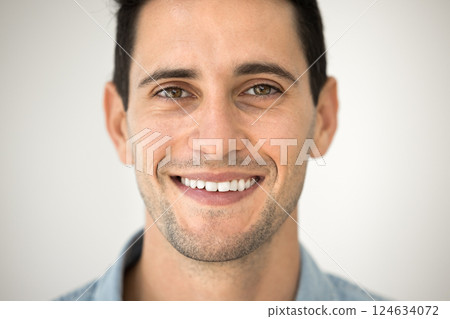 Close up happy Latin man smiling revealing perfect-white teeth 124634072