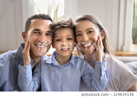 Head shot portrait of happy family with cute little son Head shot portrait of happy family with cute little son 124634136