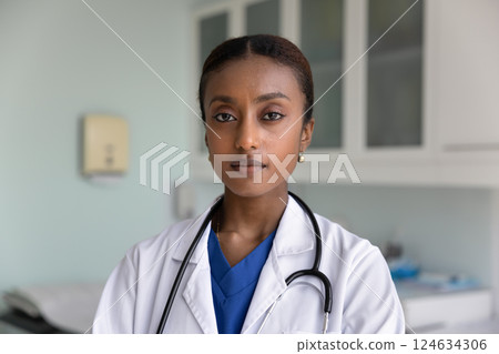 Serious beautiful African American physician woman posing for head shot 124634306