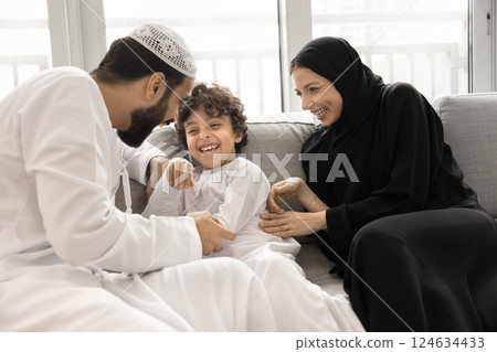 Happy Arabian family enjoy playtime at home 124634433