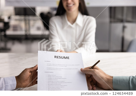 Positive female job applicant woman talking to two recruit managers 124634489