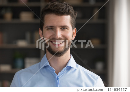 Head shot portrait smiling young man entrepreneur looking at camera Head shot portrait smiling young man entrepreneur looking at camera 124634557