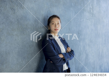 Young woman with arms folded 124634834