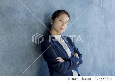 Young woman with arms folded 124634840