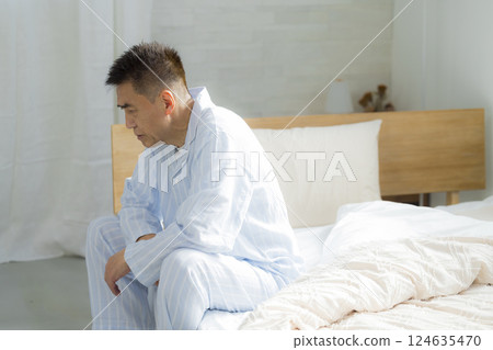 Senior man in bed feeling unwell 124635470