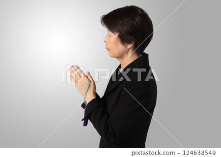 Mourning clothes, praying, funeral, image 124638549
