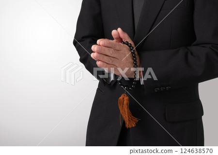 Mourning clothes, praying, funeral, image 124638570
