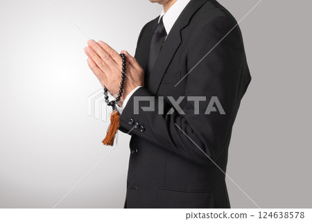 Mourning clothes, praying, funeral, image 124638578