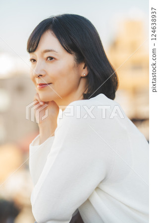 A middle-career woman enjoying the fresh air 124638937