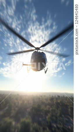 helicopter flies over forested landscape at sunrise helicopter flies over forested landscape at sunrise 124641480
