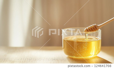 Honey in a glass container Honey in a glass container 124641708