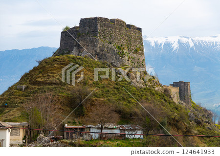 Medieval castle of Gjirokaster on background of Gjere mountains 124641933
